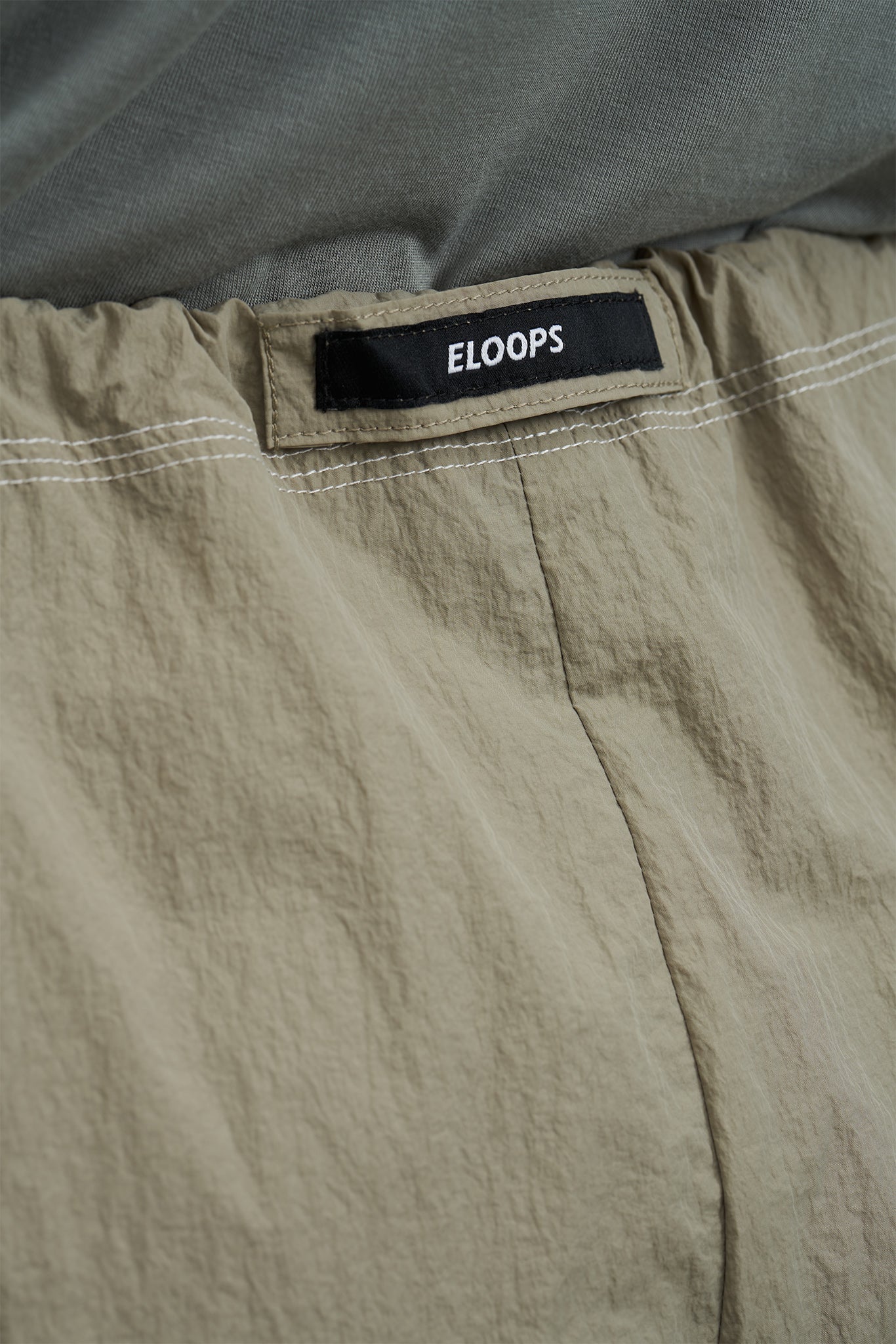 「ELOOPS」アジャスタブルナイロンワイドパンツ