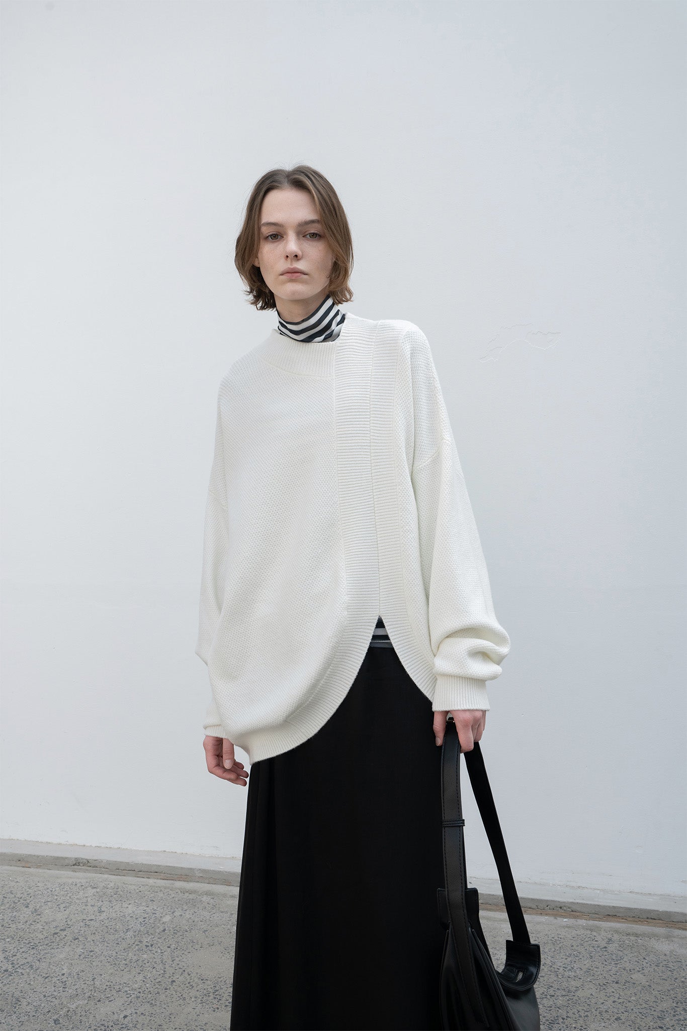 Round slit asymmetric design knit 